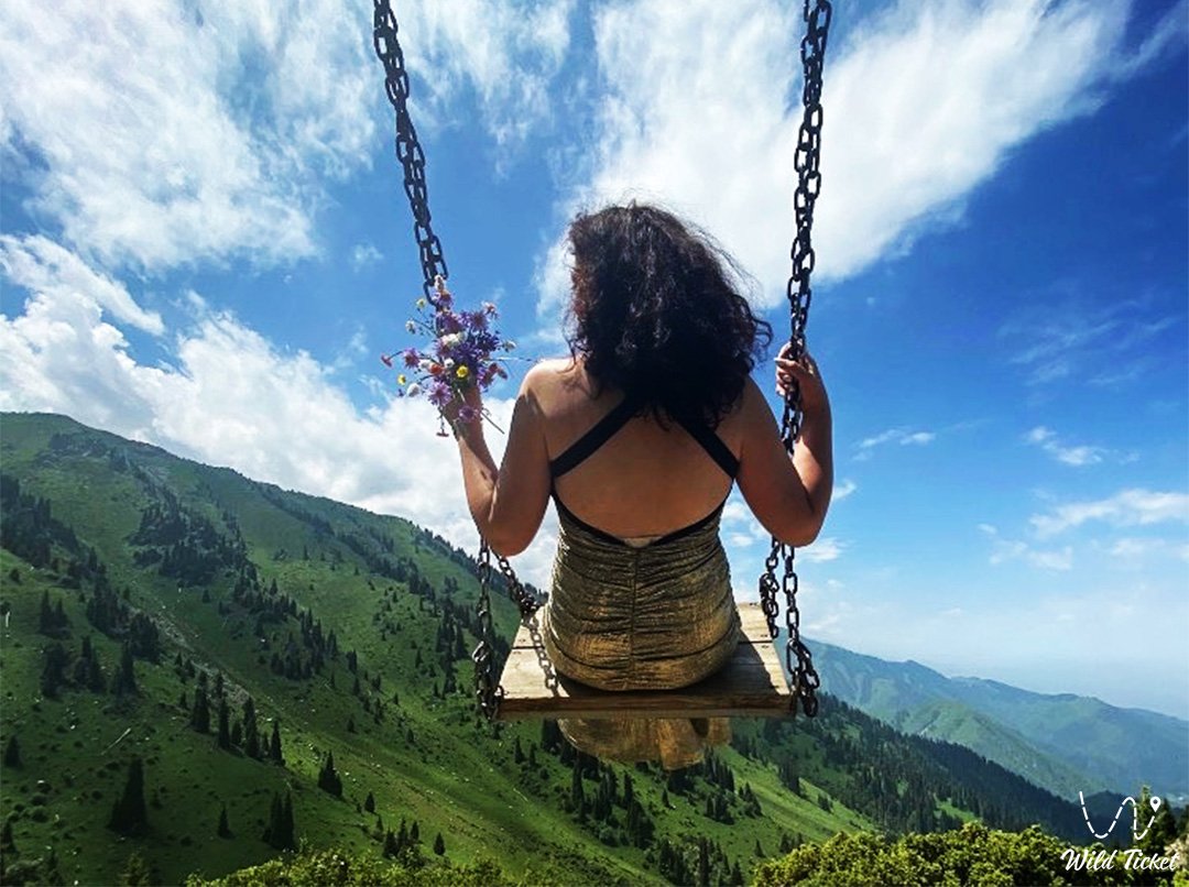 Swing in the mountains of Almaty (Kimasar gorge)